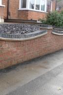 Brick wall in front of a house