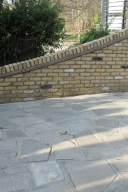 Brick wall in front of a house